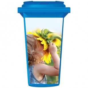 Young Girl Sniffing A Sunflower Wheelie Bin Sticker Panel